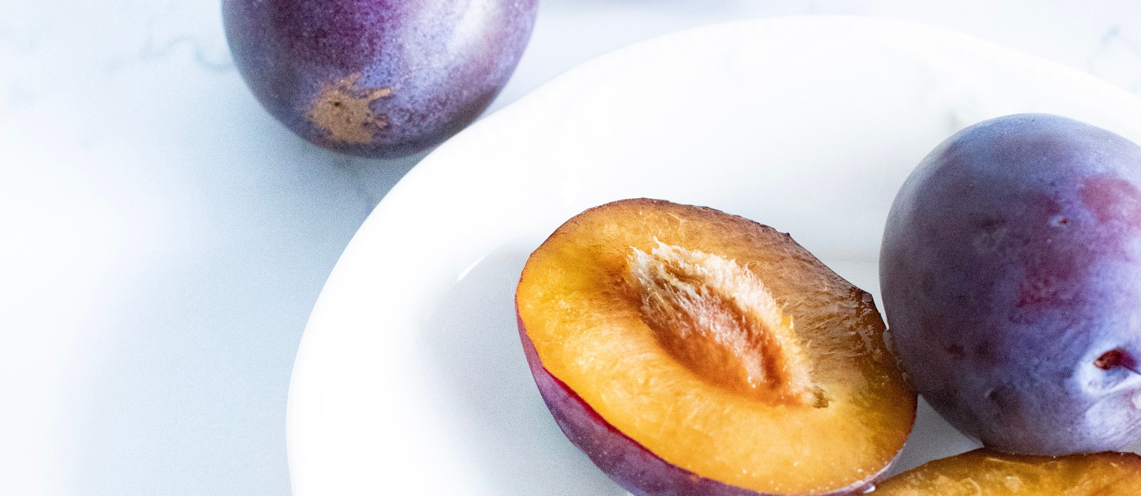 Which country produces the most plums in the world?